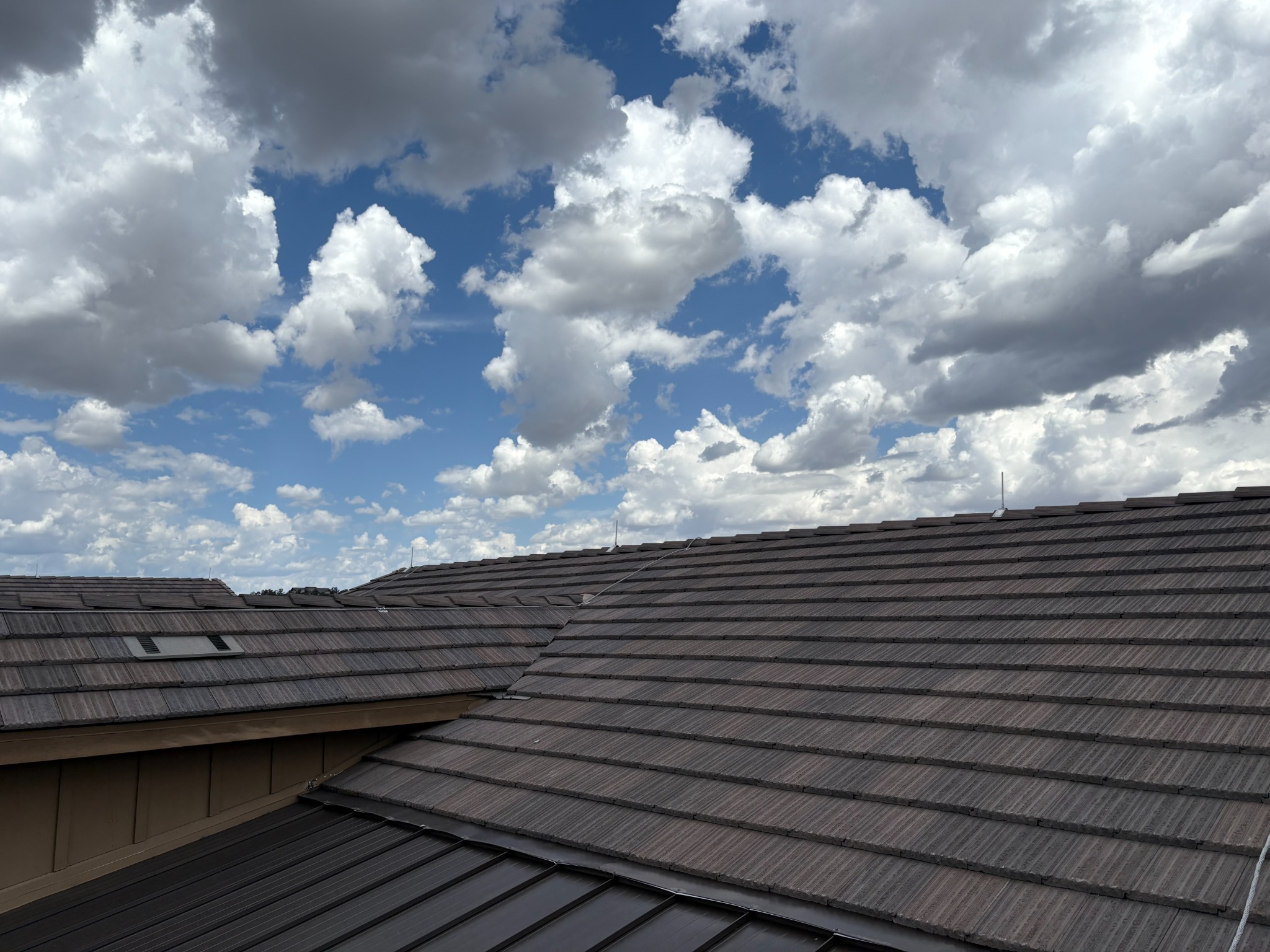 Prescott tile roof lightning rods under Arizona monsoon clouds