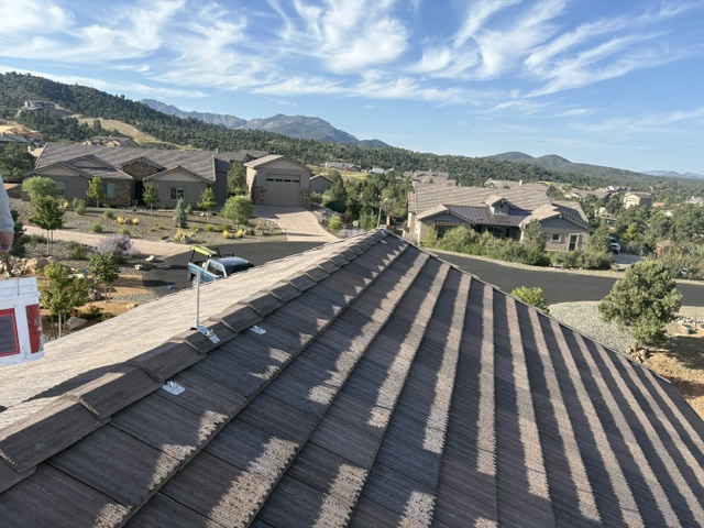 Air terminal and conductor mounted along Prescott tile roof ridge